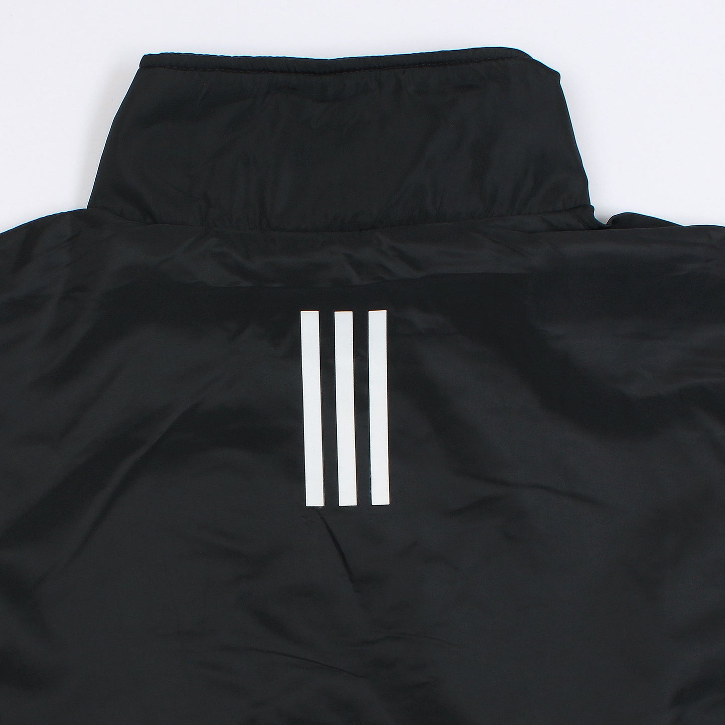 Black jacket with three white stripes on a white background